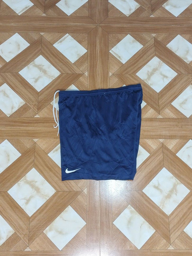 Nike Blue Dri-FIT Athletic Shorts (Category: Shorts) located in Manila. Submitted by dp.finds (Listing ID 1465766634, Image 1). Description: - Brand: Nike - Color: Navy Blue - Size: XL - Technology: Dri-FIT (lightweight & sweat-wicking) - Features: Elastic waistband with adjustable white drawstring, iconic white Nike swoosh on the leg - Condition: Great for workouts or casual wear - Origin: Made in Vietnam.
