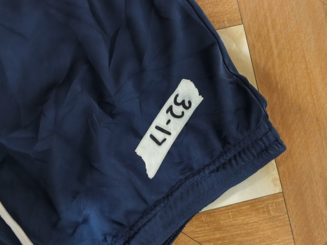 Nike Blue Dri-FIT Athletic Shorts (Category: Shorts) located in Manila. Submitted by dp.finds (Listing ID 1465766634, Image 2). Description: - Brand: Nike - Color: Navy Blue - Size: XL - Technology: Dri-FIT (lightweight & sweat-wicking) - Features: Elastic waistband with adjustable white drawstring, iconic white Nike swoosh on the leg - Condition: Great for workouts or casual wear - Origin: Made in Vietnam.