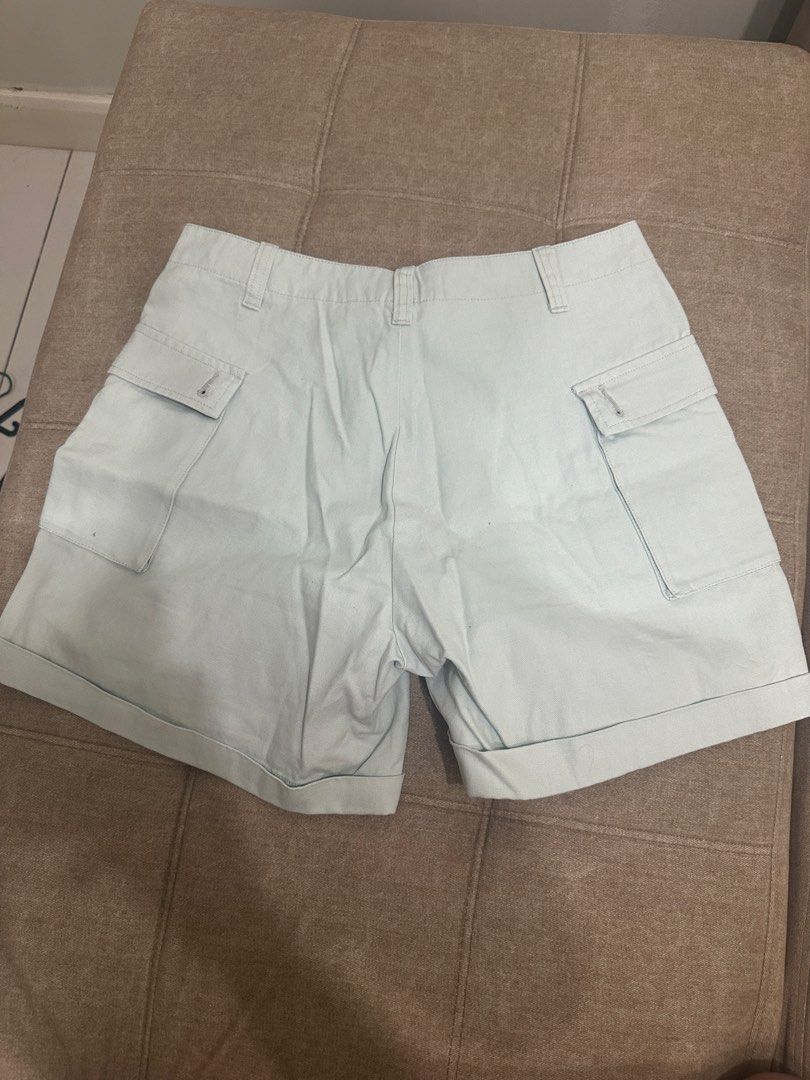 Nike Cargo Shorts Light Green Size 32 (Category: Shorts) located in Manila. Submitted by royal_vintage_thriftshop (Listing ID 1465849950, Image 3). Description: - Brand: Nike - Style: Cargo shorts with cuffed hems - Size: 32 - Color: Light green - Material: 100% heavy cotton canvas - Features: Multiple utility pockets on front and back, button fly closure, embroidered Nike swoosh on lower left pocket - Condition: Excellent.
