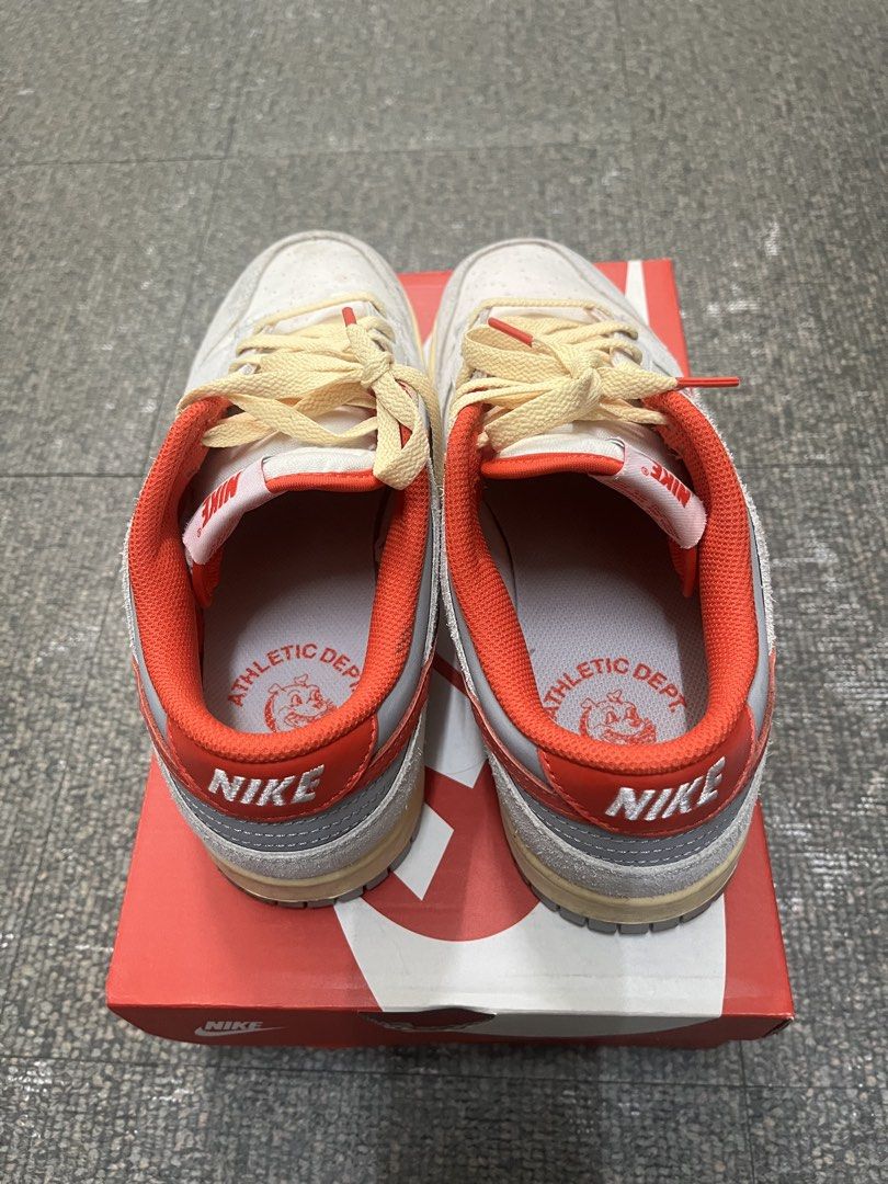 Nike Dunk Low Retro Athletic Dept (Category: Sneakers) located in Manila. Submitted by silentrabbit_8bb469 (Listing ID 1465945615, Image 3). Description: Nike Dunk Low in grey, red, and off-white with cream laces and red tips. Features 'Athletic Dept' insoles and grey outsoles with light dirt from wear. Includes the original Nike red box. Great daily beaters!.