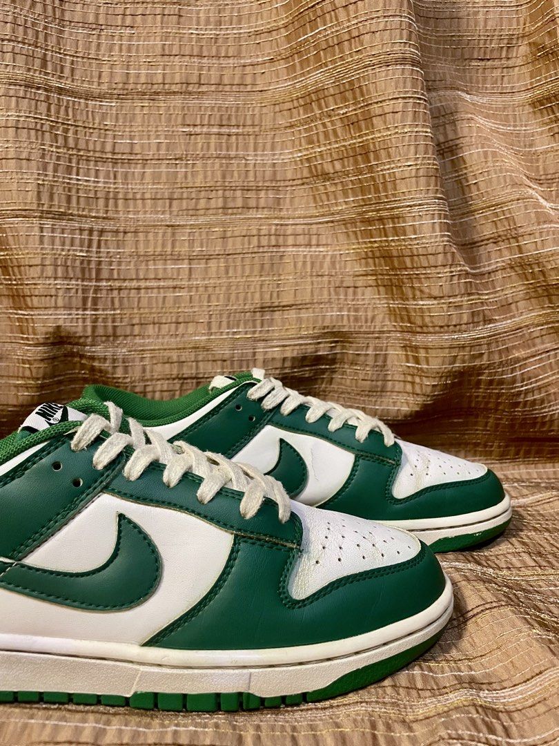 Nike Dunk Low Spartan Green (Category: Sneakers) located in Manila. Submitted by phil.fabulous (Listing ID 1465849311, Image 1). Description: - Brand: Nike - Colorway: Classic Green and White - Style: Low-top sneakers with leather upper and perforated toe box - Details: Contrast green swoosh, matching rubber outsole, white laces, and padded mesh collar - Condition: Wear and creasing visible on the toe boxes from normal use - Perfect as a stylish,