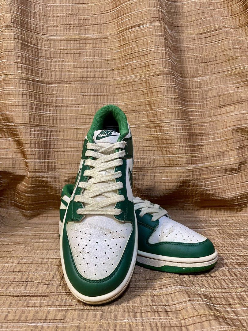 Nike Dunk Low Spartan Green (Category: Sneakers) located in Manila. Submitted by phil.fabulous (Listing ID 1465849311, Image 2). Description: - Brand: Nike - Colorway: Classic Green and White - Style: Low-top sneakers with leather upper and perforated toe box - Details: Contrast green swoosh, matching rubber outsole, white laces, and padded mesh collar - Condition: Wear and creasing visible on the toe boxes from normal use - Perfect as a stylish,