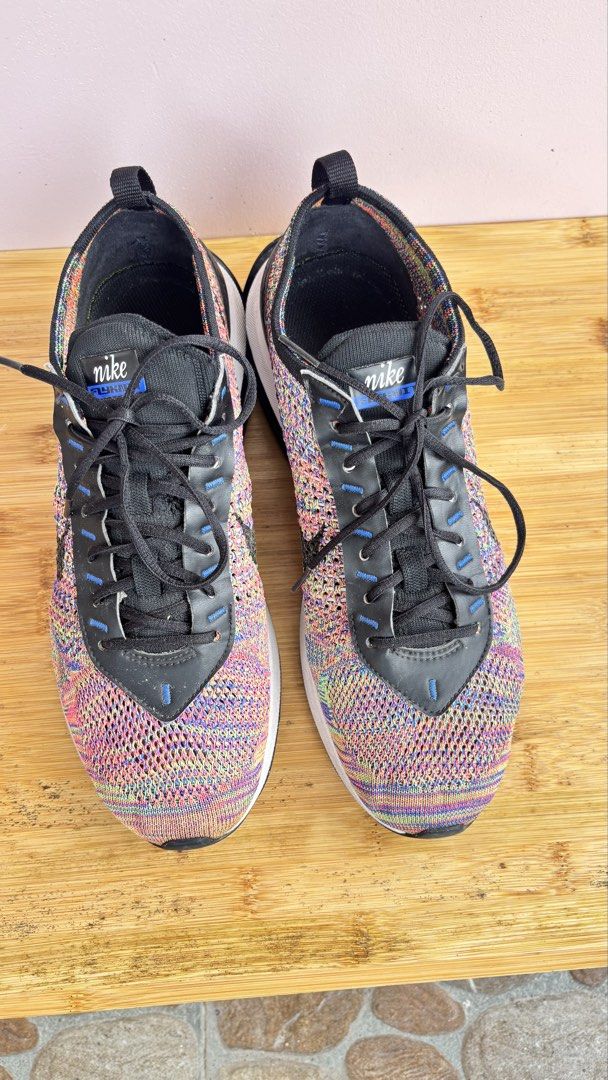Nike Flyknit Multicolor Sneakers Size US 9 (Category: Sneakers) located in Baguio. Submitted by zenforest.fd186d (Listing ID 1465788774, Image 2). Description: - Brand: Nike - Model/Style Code: FD2765-900 - Size: US 9 / UK 8 / EUR 42.5 - Colorway: Multicolor rainbow knit with black accents - Features: Visible air cushioning sole, black laces, and leather eyestays - Condition: Clean soles, crisp knit pattern, and plenty of life left - Perfect for:
