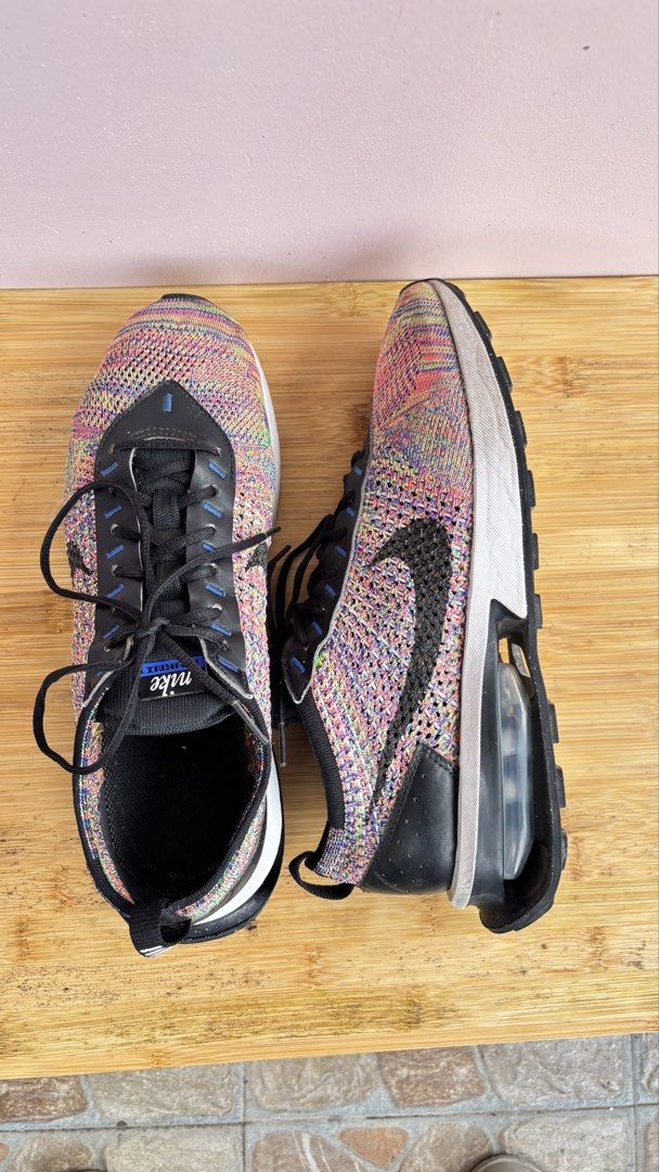 Nike Flyknit Multicolor Sneakers Size US 9 (Category: Sneakers) located in Baguio. Submitted by zenforest.fd186d (Listing ID 1465788774, Image 3). Description: - Brand: Nike - Model/Style Code: FD2765-900 - Size: US 9 / UK 8 / EUR 42.5 - Colorway: Multicolor rainbow knit with black accents - Features: Visible air cushioning sole, black laces, and leather eyestays - Condition: Clean soles, crisp knit pattern, and plenty of life left - Perfect for: