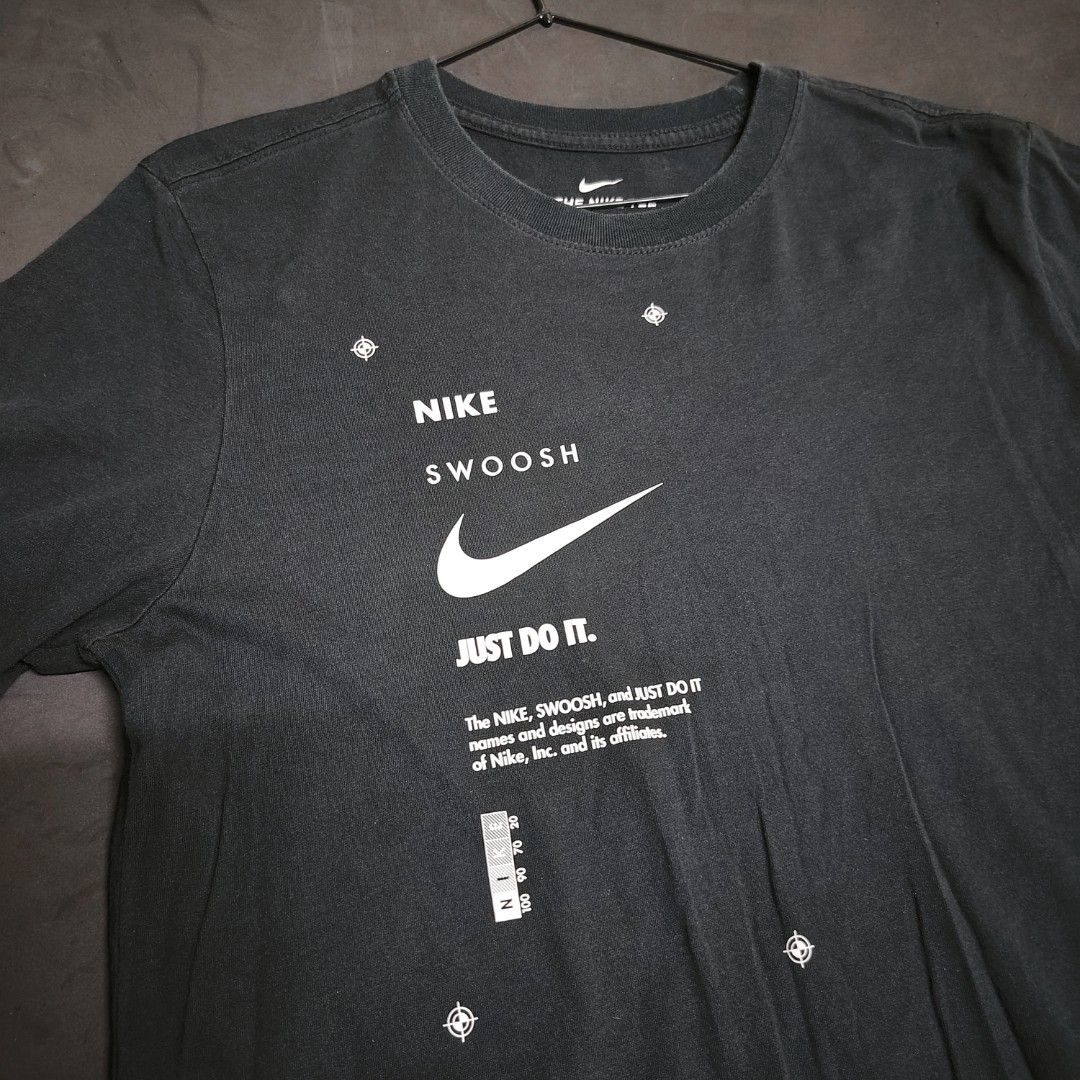 Nike Just Do It Graphic Tee (Category: Tshirts & Polo Shirts ) located in General Santos City (Dadiangas). Submitted by angelodemegilloceballos (Listing ID 1465835624, Image 3). Description: -Pm me for more details & measurements - Authentic Nike black graphic tee - Size: Medium (inner tag intact) - Design: Eye-catching graphic print on front and back with white text and swoosh branding - Fit: Standard fit crew neck - Material: Comfortable, high-