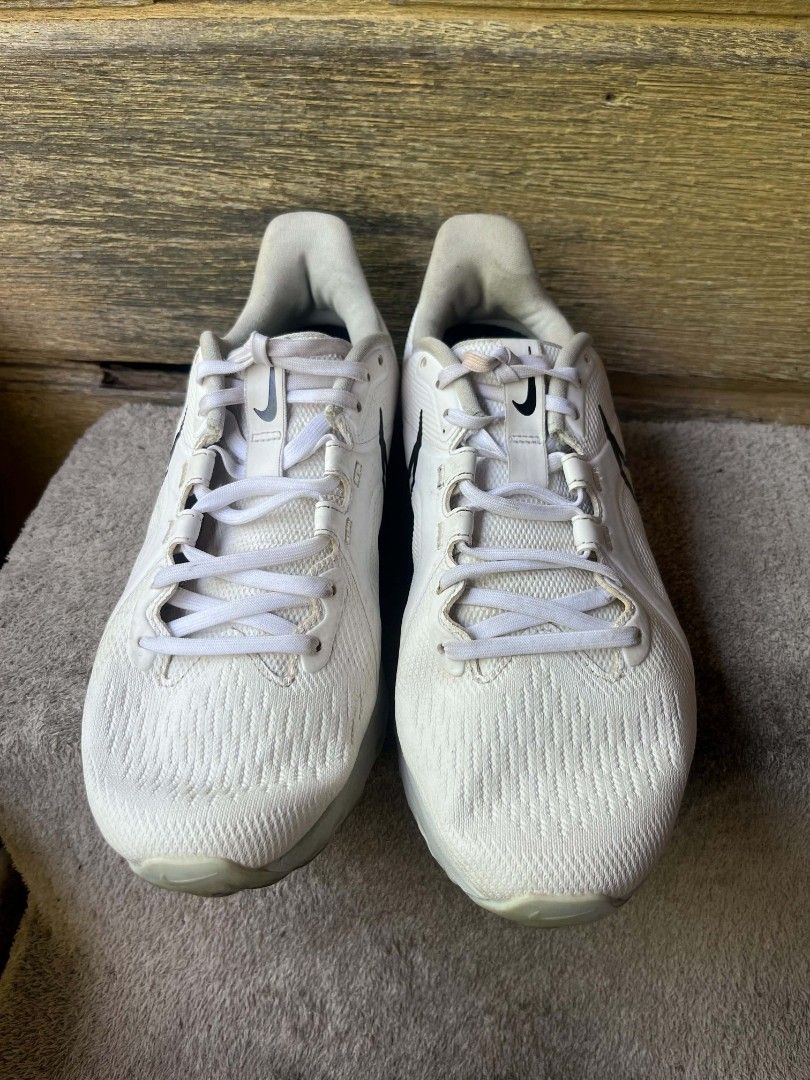 Nike React Infinity Pro White Black Golf Shoes (Category: Sneakers) located in Baroy. Submitted by laudecarlfe24 (Listing ID 1465834545, Image 3). Description: - Brand/Model: Nike React Golf Shoes - Colorway: White with black swoosh and white laces - Upper: Textured knit material for breathability and comfort - Sole: Spiked sole grip for optimal course performance - Details: Stacked Nike branding down the heel tab - Condition: Clean look with nor