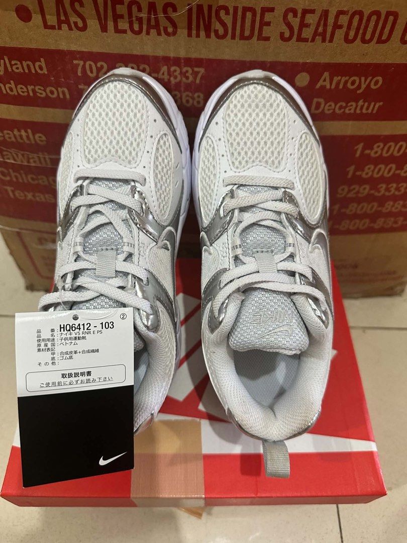 Nike V5 RNR E PS White Metallic Silver (Category: Babies & Kids Fashion) located in Caloocan City. Submitted by prelovebyoreo (Listing ID 1465824655, Image 1). Description: Brandnew Bought in Japan Size: 20cm RFS: Too big for my Son - Brand: Nike - Model: V5 RNR E PS - Color: White / Metallic Silver - Style Code: HQ6412-103 - Size: US 1Y / UK 13.5 / EUR 32 / 20 cm - Condition: Brand new with original box and tags - Features: Clean white mesh uppe