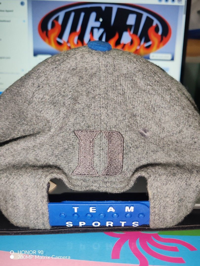 Nike vintage Duke Blue Devils Wool Snapback Hat (Category: Caps & Hats) located in Pasay City. Submitted by markjaysontabuzo (Listing ID 1465872130, Image 3). Description: - Authentic Nike Duke snapback - Grey wool crown with royal blue brim - Large embroidered blue Nike swoosh on front - White collegiate Duke lettering stitched across the bill - Blue snap closure with small embroidered Duke logo at the back - Clean interior lining with original 