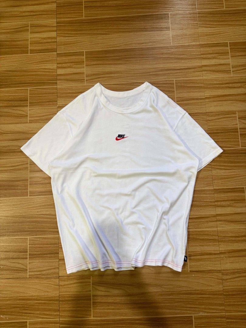 Nike White Shirt with Embroidered Logo (Category: Tshirts & Polo Shirts ) located in Dumaguete. Submitted by shanoyyy (Listing ID 1465840327, Image 2). Description: Size XL on tag Dimes: 23 width x 29 length - Authentic white Nike t-shirt - Classic embroidered Nike logo on the chest - Unique contrasting red stitching along the bottom hem Mode of Payment - Gcash - Gotyme.