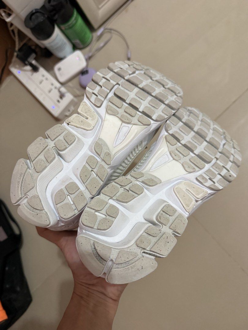 Nike Zoom Vomero 5 White Sneakers (Category: Sneakers) located in Davao. Submitted by fabdeclutter (Listing ID 1465949014, Image 3). Description: - Model: Nike Zoom Vomero 5 (All White) - Upper: Breathable mesh with durable synthetic overlays - Details: Iconic Bowerman series graphic on insoles - Sole: Waffle rubber outsole with very light wear on tread - Condition: Clean laces and padded collar, ready to wear - Style: Comfortable everyday traine
