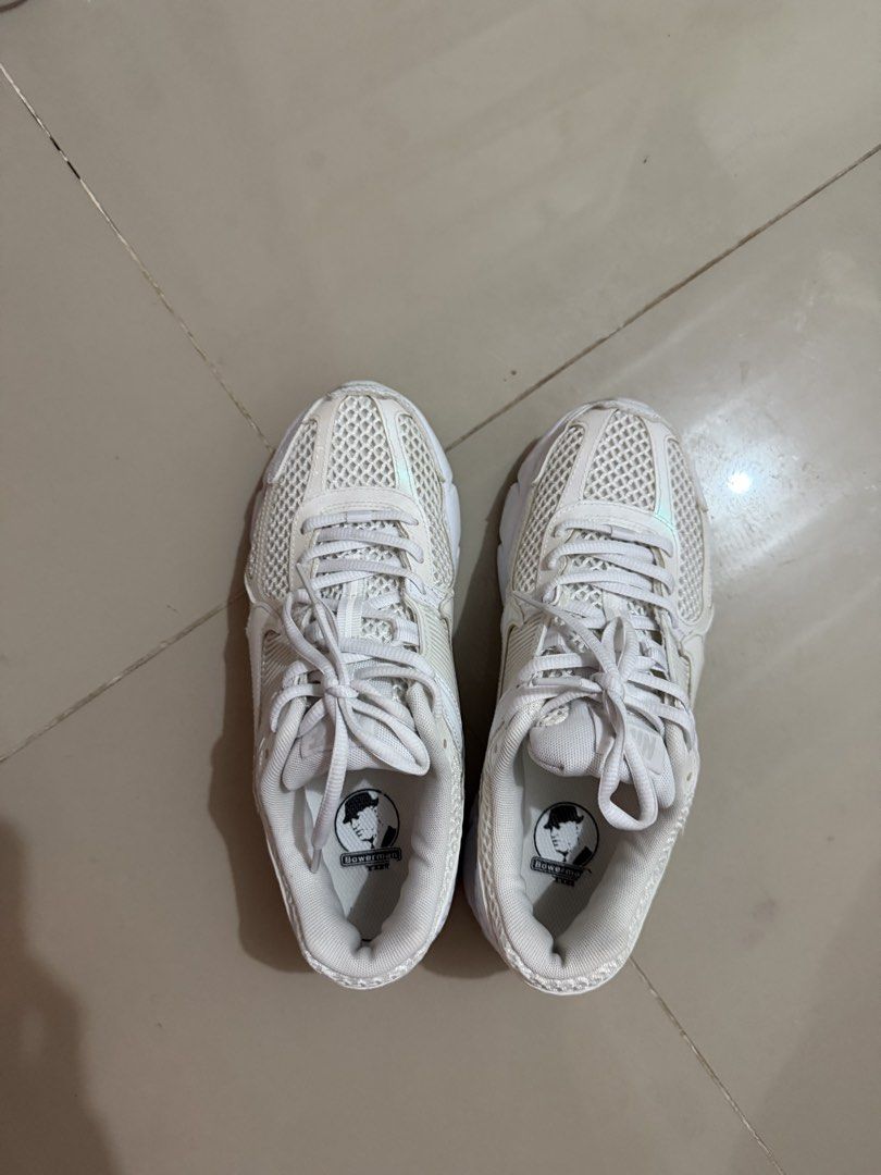 Nike Zoom Vomero 5 White Sneakers (Category: Sneakers) located in Davao. Submitted by fabdeclutter (Listing ID 1465949014, Image 1). Description: - Model: Nike Zoom Vomero 5 (All White) - Upper: Breathable mesh with durable synthetic overlays - Details: Iconic Bowerman series graphic on insoles - Sole: Waffle rubber outsole with very light wear on tread - Condition: Clean laces and padded collar, ready to wear - Style: Comfortable everyday traine