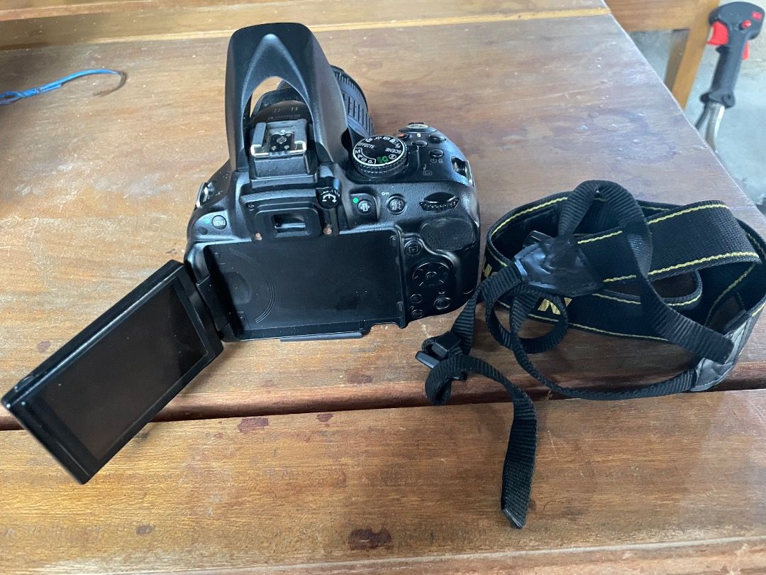Nikon DSLR camera with lens and strap (Category: Cameras) located in Caloocan City. Submitted by nino.xposure24 (Listing ID 1465911268, Image 2). Description: - Nikon digital SLR camera body in classic black - Comes with a versatile zoom lens and original branded neck strap - Built-in pop-up flash did not work but I give you a goddox flash - Articulating LCD screen flips out to the side for flexible shooting angles, issue is small vignette - Idea
