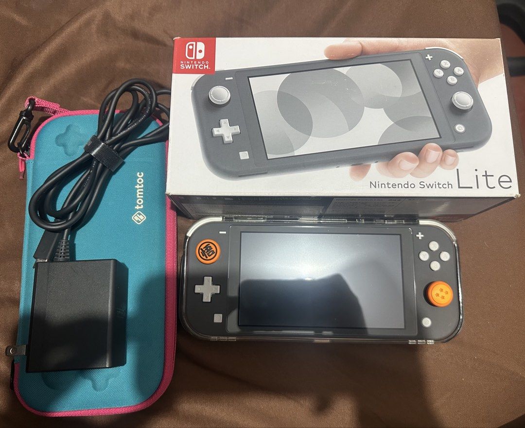 Nintendo Switch Lite (Category: Nintendo) located in Makati City. Submitted by crisdlf (Listing ID 1465922007, Image 1). Description: Bought 2025 Comes with box, charger, screen protector, Skull and Co Protective case with grips No games included .