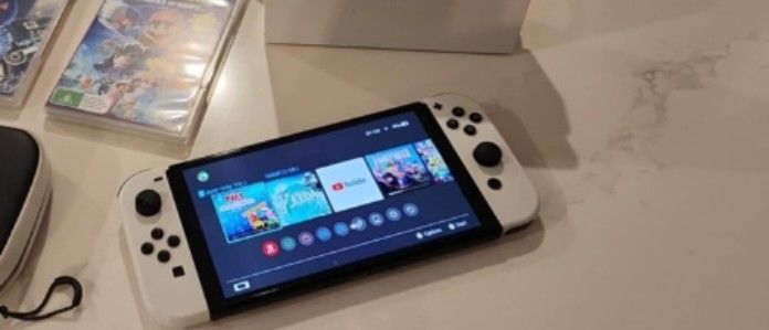 Nintendo Switch OLED Console with Games and Case (Category: Nintendo) located in Imus. Submitted by dahdahlicious (Listing ID 1459325682, Image 1). Description: - Nintendo Switch OLED Model console - Original dock and Joy-Cons included - Comes with a protective carrying case - Games included: Sonic Frontiers, Mario + Rabbids Sparks of Hope - All games are in their original cases - Ready for both home console and portable play.