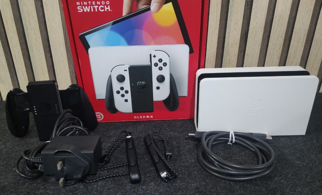 NINTENDO SWITCH OLED WHITE | COMPLETE IN BOX (Category: Nintendo) located in Caloocan City. Submitted by RetroGuild (Listing ID 1465903685, Image 2). Description: 🎮 NINTENDO SWITCH OLED WHITE | COMPLETE IN BOX 🪙 PRICE: • ₱10,499 📦 INCLUSION: ✔ Nintendo Switch OLED Main Unit (HEG-001) • Tempered Glass installed ✔ Joy-Con White (L) (HAC-015) ✔ Joy-Con White (R) (HAC-016) ✔ Switch Dock White (HEG-007) ✔ Joy-Con Grip (HAC-011) ✔ AC Adapter (HAC-00