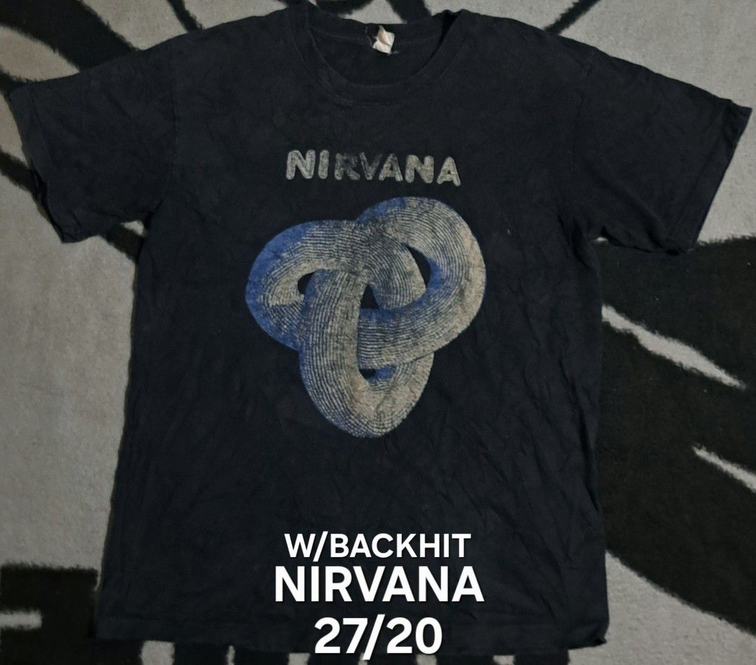 Nirvana Nevermind Band T-shirt Size S (Category: Tshirts & Polo Shirts ) located in San Fernando, Camarines Sur. Submitted by ladderaya (Listing ID 1465859796, Image 1). Description: - Item: Nirvana Nevermind Band T-Shirt - Size: Small (Original tag attached) - Design: Front graphic print with back text hit - Details: Short sleeves, crew neck, original cotton collar tag - Condition: Worn a few times with light fabric fading.