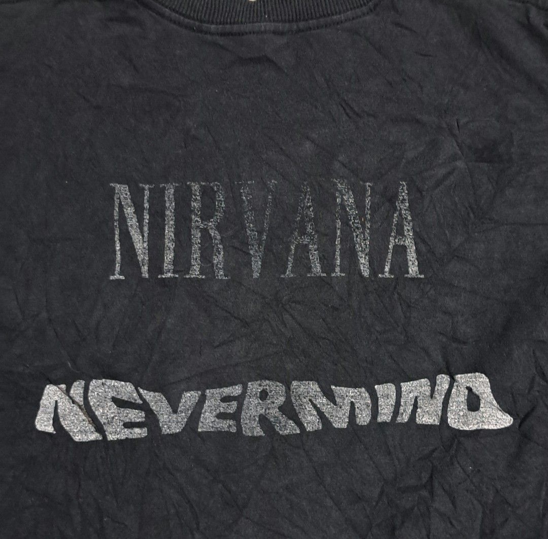 Nirvana Nevermind Band T-shirt Size S (Category: Tshirts & Polo Shirts ) located in San Fernando, Camarines Sur. Submitted by ladderaya (Listing ID 1465859796, Image 2). Description: - Item: Nirvana Nevermind Band T-Shirt - Size: Small (Original tag attached) - Design: Front graphic print with back text hit - Details: Short sleeves, crew neck, original cotton collar tag - Condition: Worn a few times with light fabric fading.
