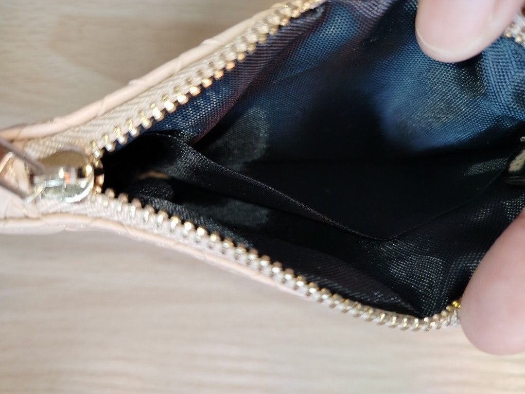 Nude woven leather coin pouch with keychain (Category: Purses & Pouches) located in Rizal. Submitted by etcthings (Listing ID 1465868172, Image 2). Description: - Color: Nude with elegant woven faux leather pattern - Hardware: Gold zipper closure and matching keychain ring - Interior: Clean black fabric lining - Size: Compact, ideal for cards, cash, and small essentials - Condition: Clean inside and out, ready for daily use.