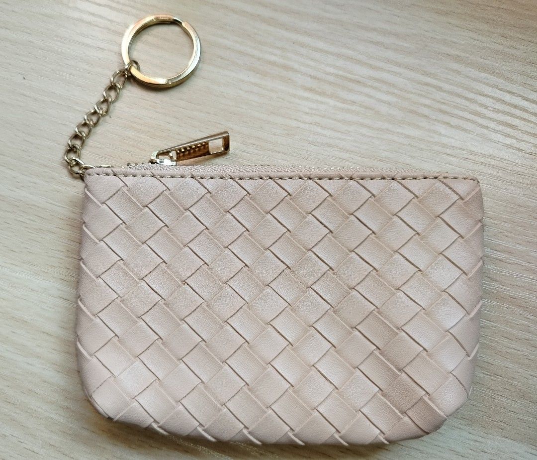 Nude woven leather coin pouch with keychain (Category: Purses & Pouches) located in Rizal. Submitted by etcthings (Listing ID 1465868172, Image 1). Description: - Color: Nude with elegant woven faux leather pattern - Hardware: Gold zipper closure and matching keychain ring - Interior: Clean black fabric lining - Size: Compact, ideal for cards, cash, and small essentials - Condition: Clean inside and out, ready for daily use.