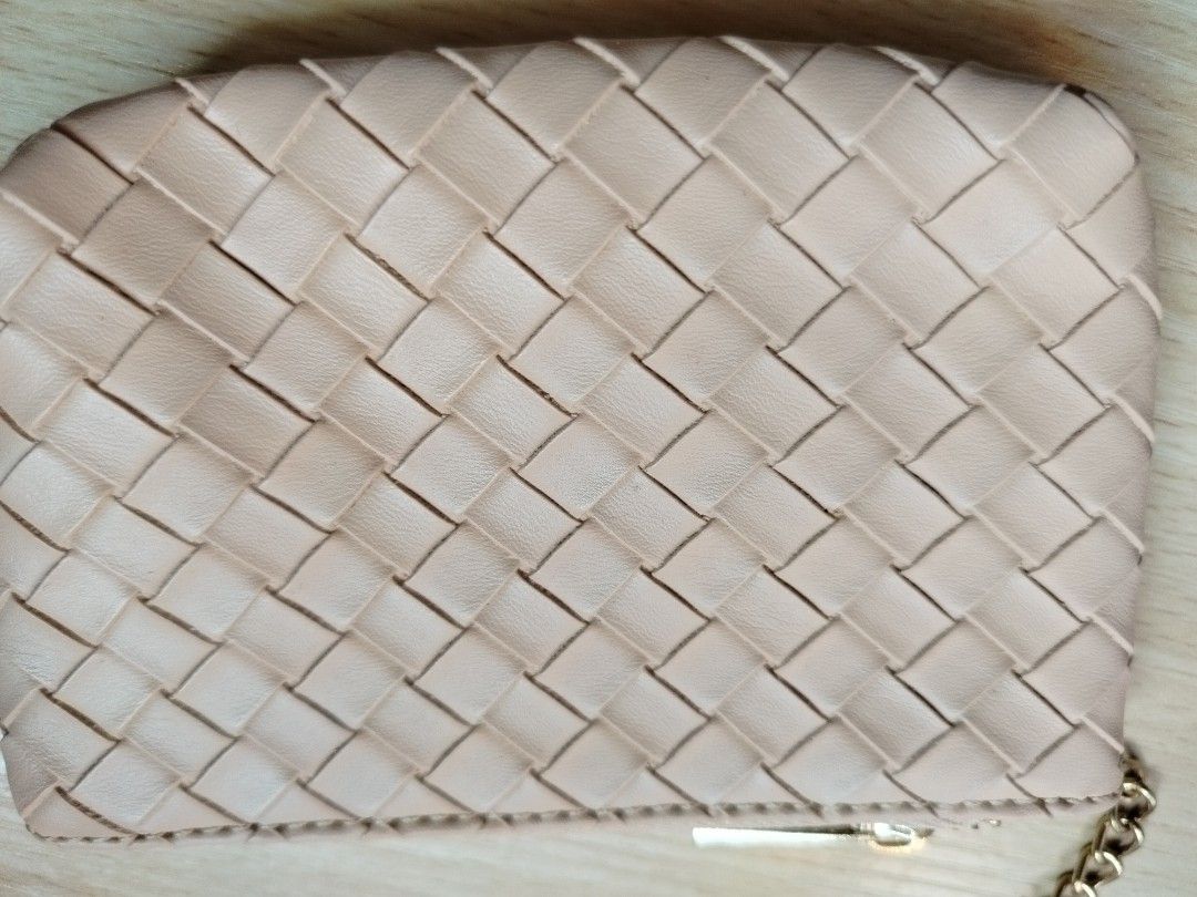 Nude woven leather coin pouch with keychain (Category: Purses & Pouches) located in Rizal. Submitted by etcthings (Listing ID 1465868172, Image 3). Description: - Color: Nude with elegant woven faux leather pattern - Hardware: Gold zipper closure and matching keychain ring - Interior: Clean black fabric lining - Size: Compact, ideal for cards, cash, and small essentials - Condition: Clean inside and out, ready for daily use.