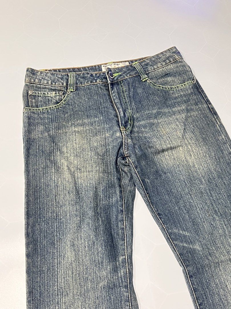 Number (N)ine Distressed Denim Jeans (Category: Jeans) located in Caloocan City. Submitted by lostarchive_55 (Listing ID 1465915088, Image 3). Description: - Brand: Number (N)ine - Wash: Blue acid wash with subtle fading - Details: Neon green accent stitching on waistband and pockets - Fit: Classic straight leg - Hardware: Branded button closure and interior waist label - Style: Standard five-pocket design with back pocket detailing - Condition: 