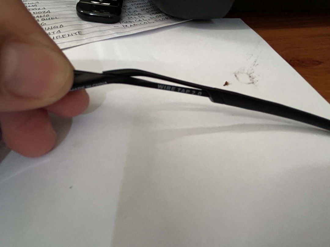 Oakley Wire Tap 2.0 Sunglasses Blue Mirror (Category: Sunglasses & Eyewear) located in Floridablanca. Submitted by davidpault15196 (Listing ID 1465842495, Image 3). Description: - Authentic Oakley Wire Tap 2.0 (OO4145-0460) - Frame & Lenses: Black metal wire frames with striking blue mirror lenses - Measurements: Temple length 136 - Condition: Sturdy and lightweight with slight yellowing on the nose pads due to age/wear - Best For: Outdoor activi