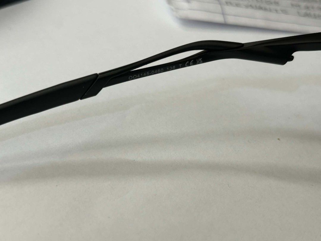 Oakley Wire Tap 2.0 Sunglasses Blue Mirror (Category: Sunglasses & Eyewear) located in Floridablanca. Submitted by davidpault15196 (Listing ID 1465842495, Image 2). Description: - Authentic Oakley Wire Tap 2.0 (OO4145-0460) - Frame & Lenses: Black metal wire frames with striking blue mirror lenses - Measurements: Temple length 136 - Condition: Sturdy and lightweight with slight yellowing on the nose pads due to age/wear - Best For: Outdoor activi