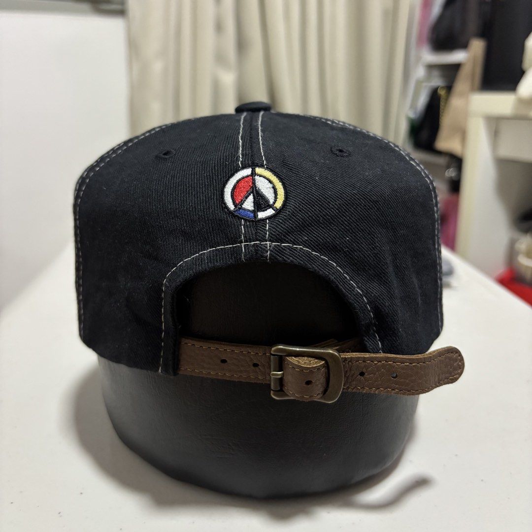 OGARP Baseball Cap W/ Leather strap (Category: Caps & Hats) located in Quezon City. Submitted by grailph (Listing ID 1465882395, Image 3). Description: - Brand/Model: OGARP Vintage Casual Cap - Colorway: Black and off-white - Material: 100% cotton for all-day comfort - Design: Front graphic embroidery and peace sign embroidery on the back - Closure: Adjustable brown leather strapback with metal buckle - Details: Original Garment Project inside ta