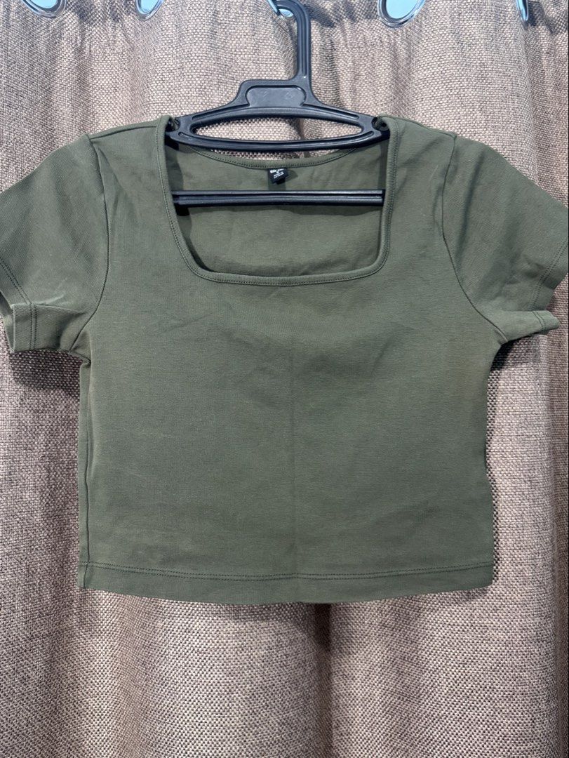 Olive Green Square Neck Crop Top Short Sleeve (Category: Shirts) located in Naga. Submitted by danisj (Listing ID 1465947762, Image 1). Description: - Color: Olive green - Material: Ribbed cotton - Design: Square neckline, short sleeves, fitted cut - Hem: Clean hem at bottom and sleeves - Style: Minimalist everyday basic piece.