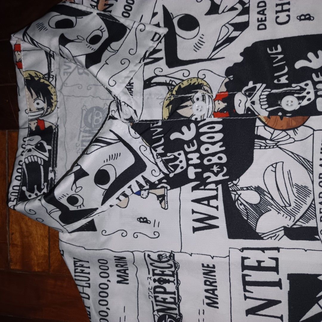 One Piece Wanted Poster Anime Button Up Shirt (Category: Tshirts & Polo Shirts ) located in Manila. Submitted by ekko_0xx (Listing ID 1465885149, Image 2). Description: - Design: All-over One Piece wanted poster manga print featuring Luffy, Zoro, Sanji, Chopper, and Brook - Style: Short sleeve button-up shirt with classic collared neckline and white buttons - Fit: Standard fit, lightweight and breathable fabric - Perfect for: Casual wear, anime c