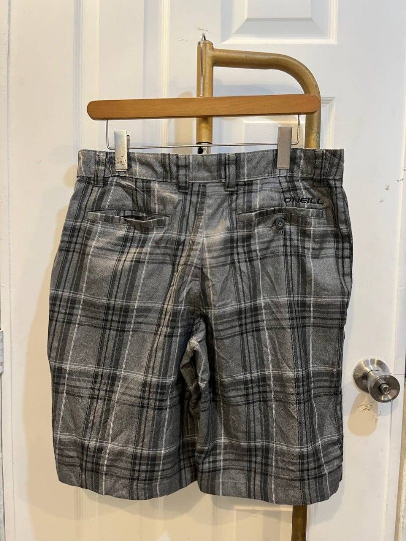 O'Neill Concha Grey Plaid Shorts Size 32 (Category: Shorts) located in Quezon City. Submitted by chicberry (Listing ID 1465762517, Image 2). Description: - Brand/Model: O'Neill Concha Plaid Shorts - Colorway: Grey, black, and white - Size: 32 waistband - Material: 70% polyester, 30% viscose blend - Details: Button closure on back pocket with embroidered logo - Care: Machine washable - Condition: Great casual style for warm weather.