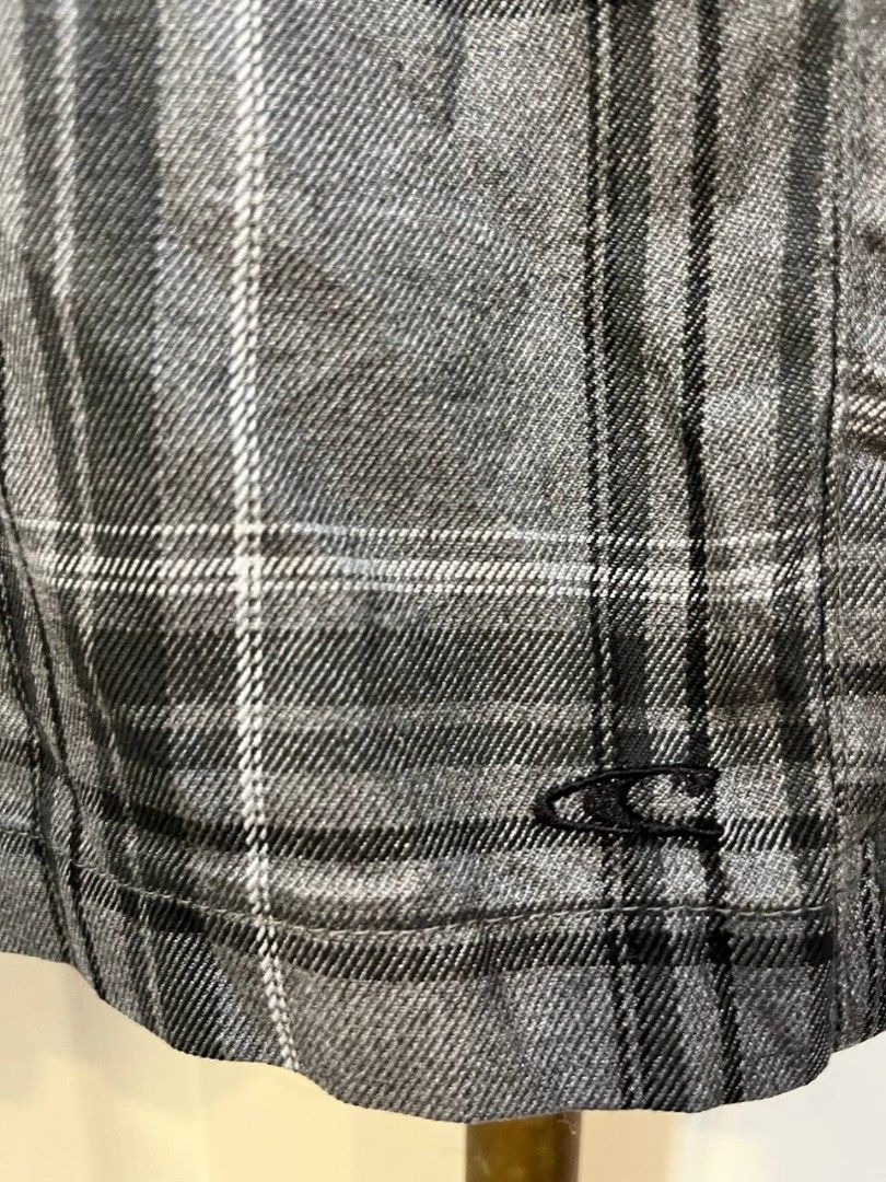 O'Neill Concha Grey Plaid Shorts Size 32 (Category: Shorts) located in Quezon City. Submitted by chicberry (Listing ID 1465762517, Image 3). Description: - Brand/Model: O'Neill Concha Plaid Shorts - Colorway: Grey, black, and white - Size: 32 waistband - Material: 70% polyester, 30% viscose blend - Details: Button closure on back pocket with embroidered logo - Care: Machine washable - Condition: Great casual style for warm weather.