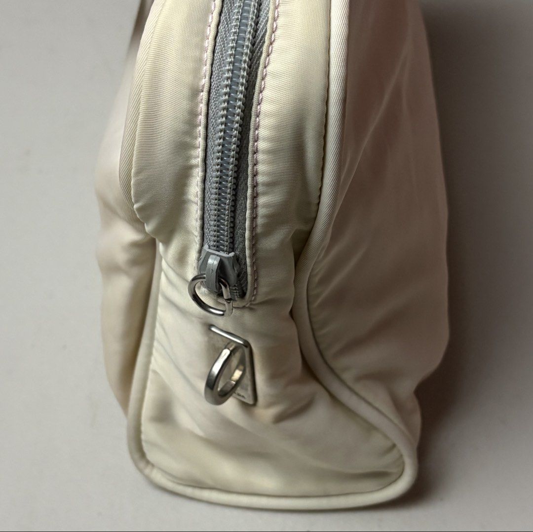 Orig Prada Nylon Handbag Cream Pink (Category: Luxury Bags & Wallets) located in Manila. Submitted by hippiesph (Listing ID 1465935650, Image 3). Description: PRADA NYLON - HAND BAG / TOTE BAG Authentic CHECK DETAILS POSTED Price: 3k + sf Dm for more details 📩.