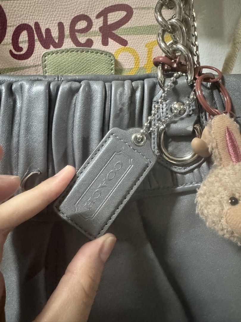 Original Coach Bag (Category: Shoulder Bags) located in Manila. Submitted by maria200918 (Listing ID 1465827529, Image 2). Description: 👜 FOR SALE — ORIGINAL COACH BAG 👜 ✨ Authentic/Original Coach ✨ Ideal Zipper ✨ Embossed Leather ✨ Rank A — Excellent Condition ✨ Elegant gray color, classy and timeless ✨ Comes with the Coach tag + cute bunny charm 🐰 Perfect for everyday use or as a stylish addition to your collection. Spacious, elegant, and st