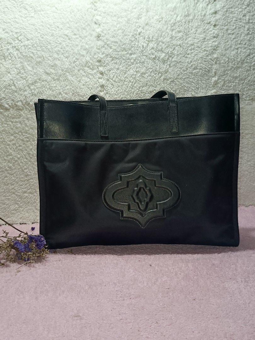 ORYANY tote bag (Category: Tote Bags) located in Taguig. Submitted by shop.etherealph (Listing ID 1465894483, Image 1). Description: Brand: ORYANY ‎Name: Tote Bag ‎Details: Oryany black tote bag, easily recognized by the distinctive embossed Moroccan medallion logo centered on the front. ‎ ‎Condition: Pre-Loved with Minimal to NO sign of usage. ‎Inclusion: Dust Bag ‎ ‎Disclaimer: We are not affiliated with, sponsored by, or related to any of the 