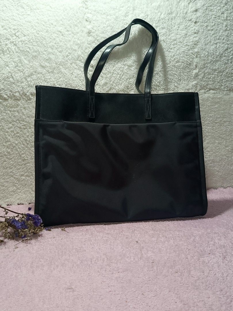 ORYANY tote bag (Category: Tote Bags) located in Taguig. Submitted by shop.etherealph (Listing ID 1465894483, Image 3). Description: Brand: ORYANY ‎Name: Tote Bag ‎Details: Oryany black tote bag, easily recognized by the distinctive embossed Moroccan medallion logo centered on the front. ‎ ‎Condition: Pre-Loved with Minimal to NO sign of usage. ‎Inclusion: Dust Bag ‎ ‎Disclaimer: We are not affiliated with, sponsored by, or related to any of the 