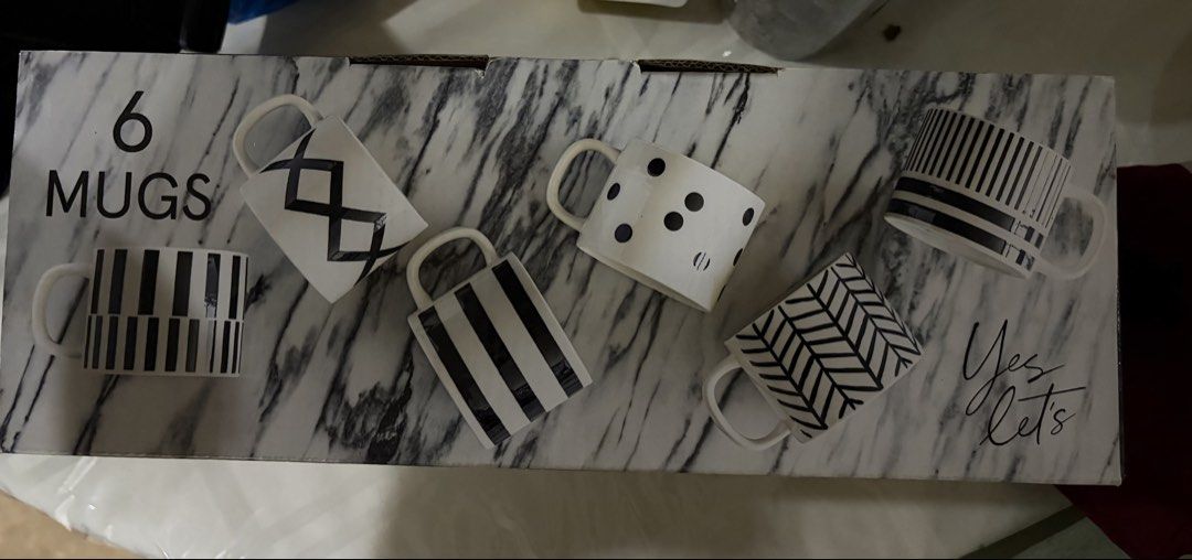 Over & Back 6 Mugs Set Black White Patterns (Category: Coffee & Tea Tableware) located in Quezon City. Submitted by din728 (Listing ID 1465838359, Image 2). Description: - Brand: Over & Back - Quantity: Set of 6 ceramic mugs - Design: Modern monochrome with assorted black and white patterns (stripes, dots, chevrons) - Ideal for: Daily coffee, tea, or as a housewarming gift - Packaging: Comes in the original printed box.