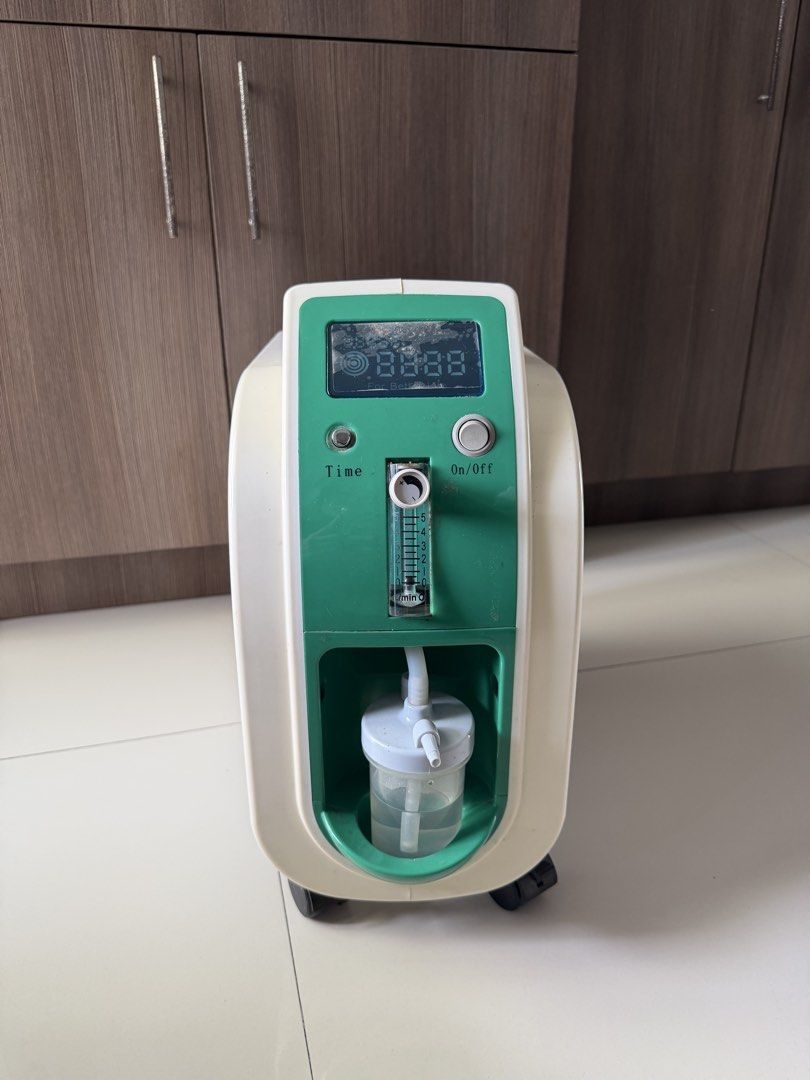 Owgels Oxygen Concentrator Model ZY-801 (Category: Medical Supplies & Tools) located in Guiguinto. Submitted by carlasalamat (Listing ID 1465782561, Image 2). Description: - Model: Owgels Oxygen Concentrator ZY-801 - Condition: Complete with original box and power cord - Display: Clear digital display with built-in flow meter - Features: Convenient control panel and intelligent alarm system - Design: Equipped with cooling fan and wheels for easy 