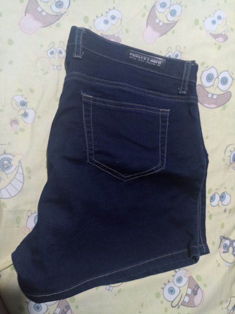 Paddock's Jeans Co Denim Shorts Size 36 (Category: Shorts) located in Manila. Submitted by hobbymo_koleksyon.ph (Listing ID 1465939628, Image 1). Description: - Brand: Paddock's Jeans Co. - Size: 36 (inner waistband tag) - Color/Wash: Dark blue denim / clean dark wash - Style: Classic five-pocket design with contrast stitching - Details: Branded gold-tone button closure, back leather logo patch, and striped inner lining along the front opening - 