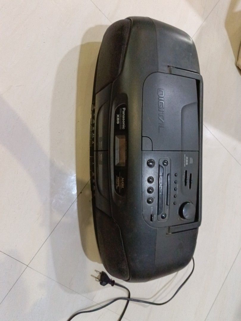 Panasonic MASH Digital XBS Portable Stereo Boombox (Category: Soundbars, Speakers & Amplifiers) located in San Juan City. Submitted by pinkdenxel (Listing ID 1465799913, Image 1). Description: - Brand: Panasonic - Type: Boombox with CD player and cassette deck - Features: Dual side speakers, front control panel, working audio - Condition: Normal signs of use on plastic casing, fully functional - Inclusions: Attached power cord - RFS: Decluttering