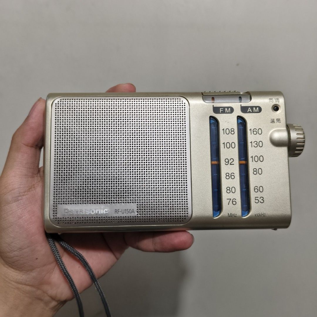 Panasonic Radio (Category: Portable Music Players) located in Pateros City. Submitted by randomsheesh (Listing ID 1465796328, Image 1). Description: Up for sale is a classic Panasonic RF-U150A portable AM/FM transistor radio in a clean metallic finish. Compact, reliable, and perfect for audio enthusiasts, collectors, or everyday listening during power outages and emergencies! Key Features: Model: Panasonic RF-U150A Bands: AM / FM Dual Band Design