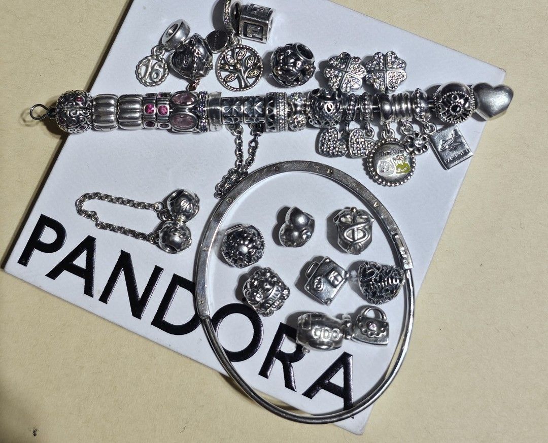Pandora bracelet and charms (Category: Charms) located in Manila. Submitted by onlinesmartshopping12 (Listing ID 1465887308, Image 1). Description: all original mix of new and preloved but pass as new new keep safe with rosegold - 1800 new Taiwan sioma travel -2500 new loveu - 1500 preloved bangle with receipt - 3000 medical cadaceus 14k - 2500 two tone 14k family dangle - 2200 two tone 14k family - 2200 family safety chain - 2500 heart dangle 2p