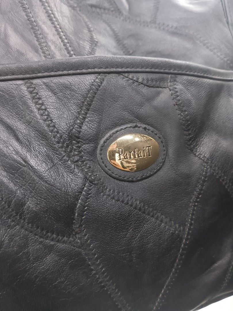 Parfait Black Leather Patchwork Travel Duffel Bag (Category: Luxury Bags & Wallets) located in Quezon City. Submitted by arvietekto (Listing ID 1465859572, Image 3). Description: Parfait Genuine Leather duffle bag/travel bag/sports bag excellent materials excellent quality affordable just message me for additional information and deals - Stylish black leather duffel bag featuring a unique patchwork design - Elegant gold-tone hardware and secure z