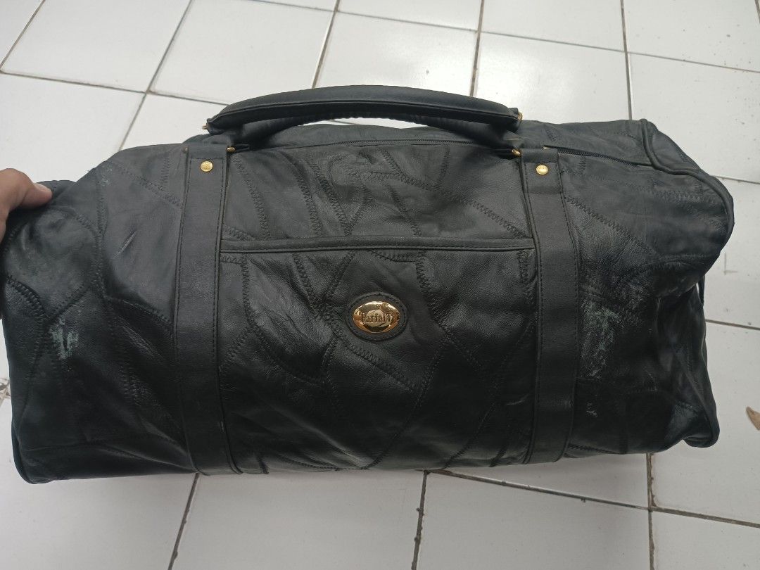 Parfait Black Leather Patchwork Travel Duffel Bag (Category: Luxury Bags & Wallets) located in Quezon City. Submitted by arvietekto (Listing ID 1465859572, Image 1). Description: Parfait Genuine Leather duffle bag/travel bag/sports bag excellent materials excellent quality affordable just message me for additional information and deals - Stylish black leather duffel bag featuring a unique patchwork design - Elegant gold-tone hardware and secure z
