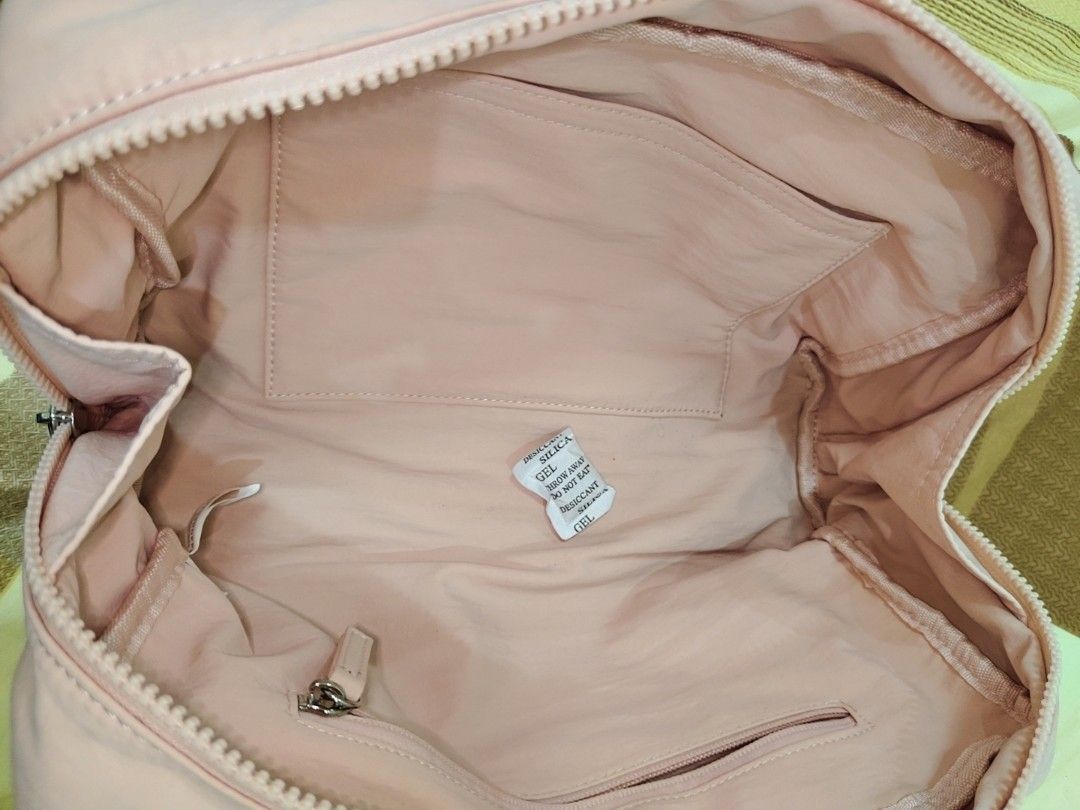 Penshoppe Pink Shoulder Bag (Category: Shoulder Bags) located in Manila. Submitted by clairevald34303 (Listing ID 1465910154, Image 2). Description: - Brand: Penshoppe - Color: Soft pink - Shape: Structured rectangle with double top handles - Closure: Secure zip closure - Interior: Matching pink fabric lining with 1 slip pocket and 1 zippered compartment - Extras: Includes matching brand tag on side hardware and silica gel packet - Condition: Cle