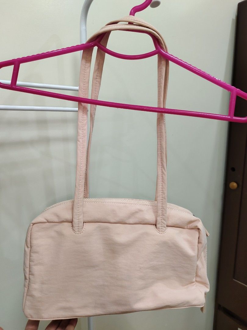 Penshoppe Pink Shoulder Bag (Category: Shoulder Bags) located in Manila. Submitted by clairevald34303 (Listing ID 1465910154, Image 1). Description: - Brand: Penshoppe - Color: Soft pink - Shape: Structured rectangle with double top handles - Closure: Secure zip closure - Interior: Matching pink fabric lining with 1 slip pocket and 1 zippered compartment - Extras: Includes matching brand tag on side hardware and silica gel packet - Condition: Cle