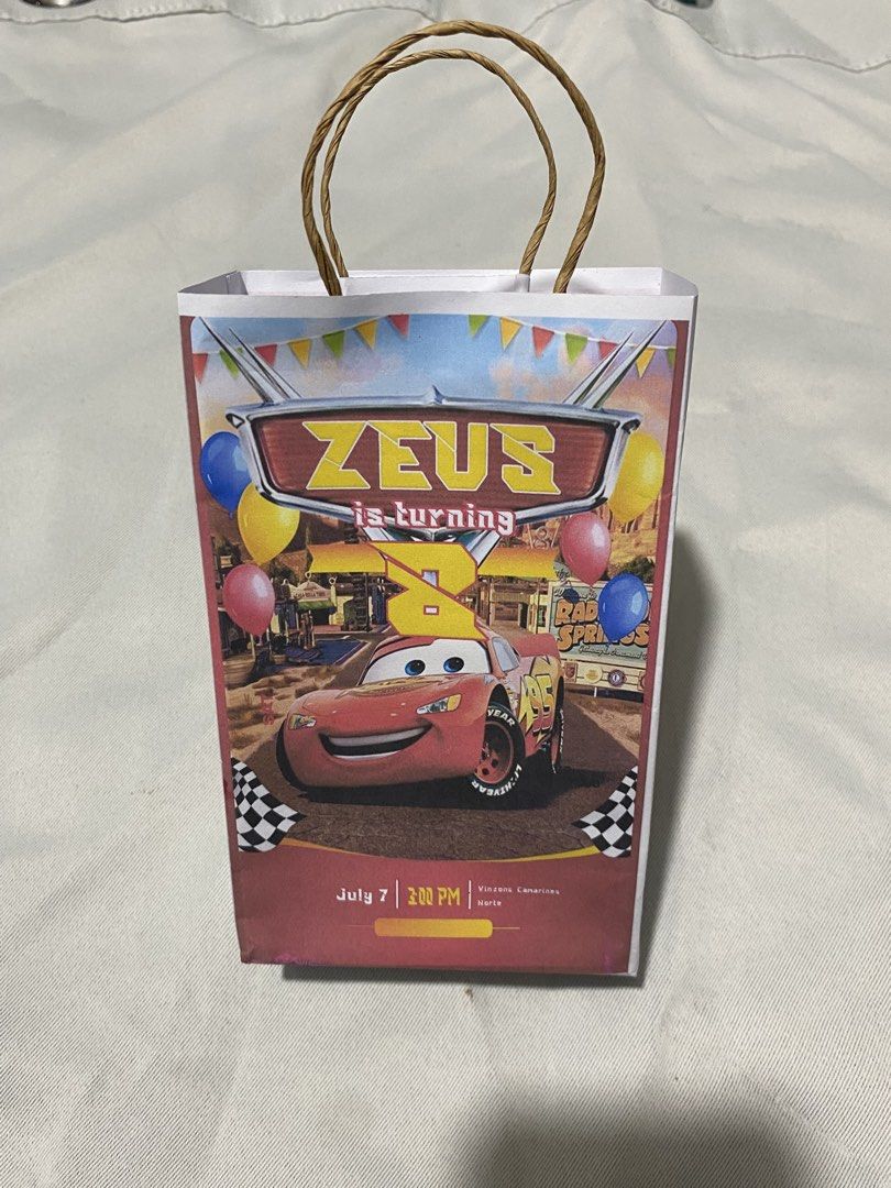 Personalized lootbags (Category: Occasions & Party Supplies) located in Pasacao. Submitted by kishhuschka (Listing ID 1465923689, Image 3). Description: - Customized paper goodie bags for kids' birthdays - Popular themes available: Cocomelon (with photo printing), Disney Cars, and Spider-Man - Features vibrant character graphics and sturdy twisted paper handles - Perfect for handing out party favors, treats, and small gifts - Multiple designs to 