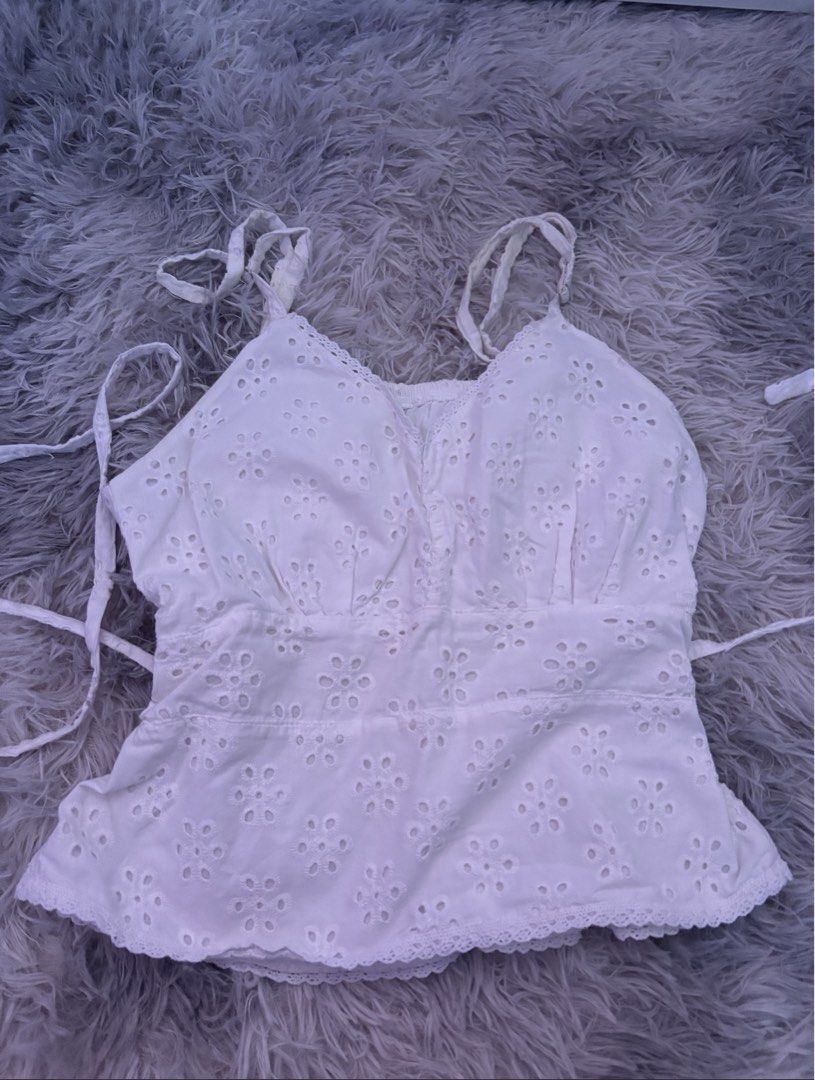 phia the label picnic top in eyelet (Category: Sleeveless) located in Marikina City. Submitted by 777stars (Listing ID 1465762983, Image 2). Description: • great condition • straps are a bit frayed from use • bust part is stitched (for more coverage) • first photo is actual when worn ! • mop: maribank / gcash • mod: jnt / lalamove.