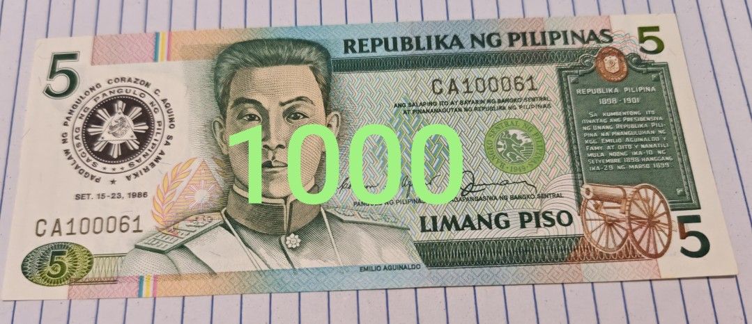 Philippine 5 Piso Banknote Emilio Aguinaldo (Category: Currency) located in Paranaque City. Submitted by independentman07 (Listing ID 1465759757, Image 1). Description: - Denomination: Philippine 5 Piso banknote - Obverse: Features Emilio Aguinaldo - Reverse: Declaration of independence scene - Date: September 15-23, 1988 - Serial Number: CA100061 - Condition: Crisp paper, sharp corners, and clean edges - Ideal for currency collectors and hobbyis