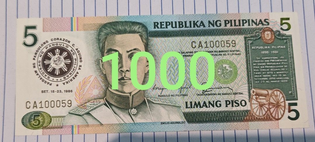 Philippines 5 Piso Banknote Emilio Aguinaldo (Category: Currency) located in Paranaque City. Submitted by independentman07 (Listing ID 1465760731, Image 1). Description: - Denomination: Philippine 5 Piso banknote - Front Design: Emilio Aguinaldo - Back Design: Declaration of Philippine Independence on June 12, 1898 - Serial Number: CA100059 - Condition: Crisp paper quality with clean edges and vibrant multi-color design - Ideal for: Currency coll